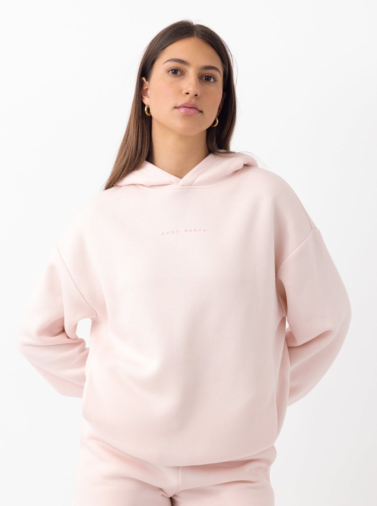 Woman in peony cityscape hoodie with white background |Color:Peony